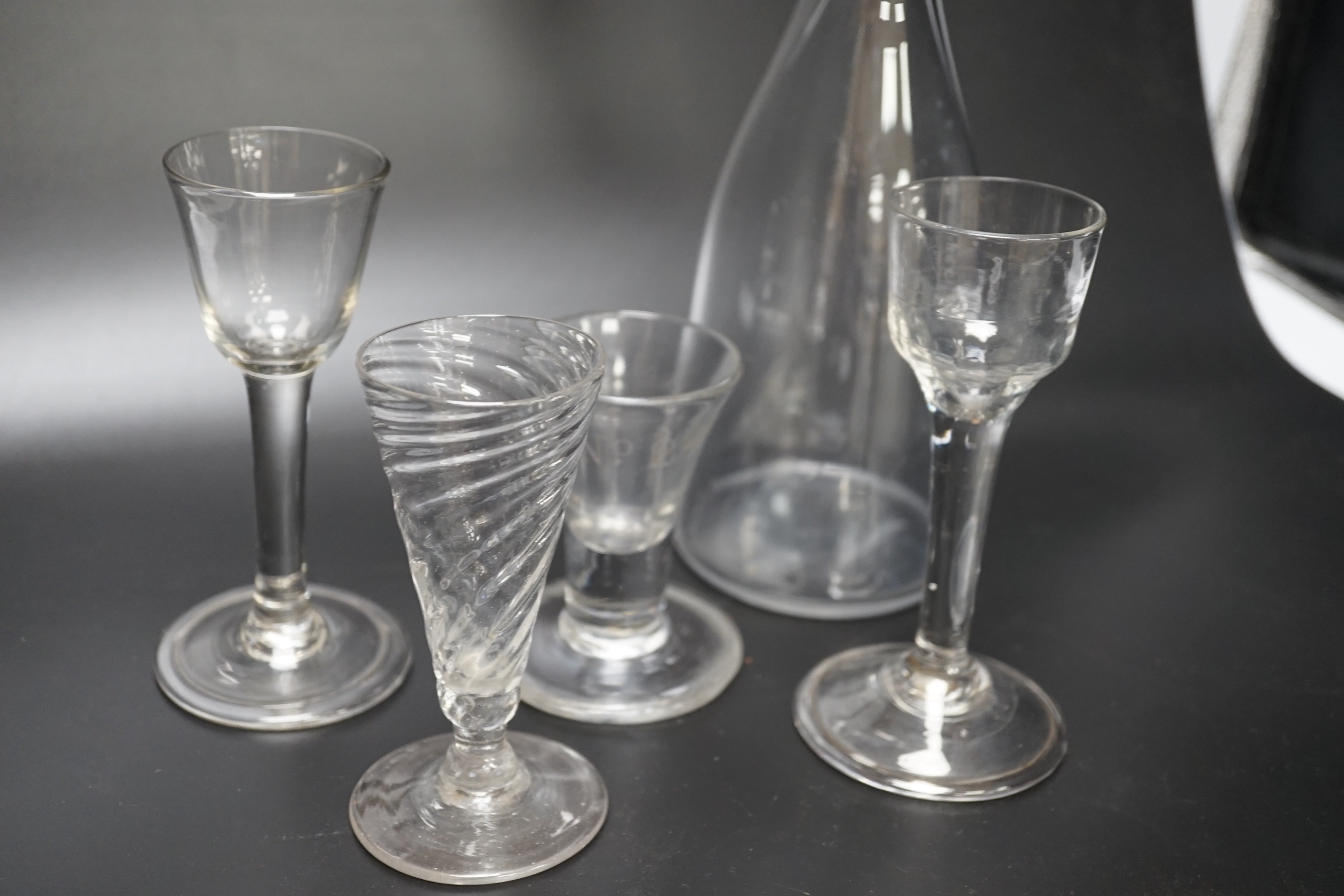 A group of four George III wine glasses and a mallet-shaped decanter, decanter 29cm